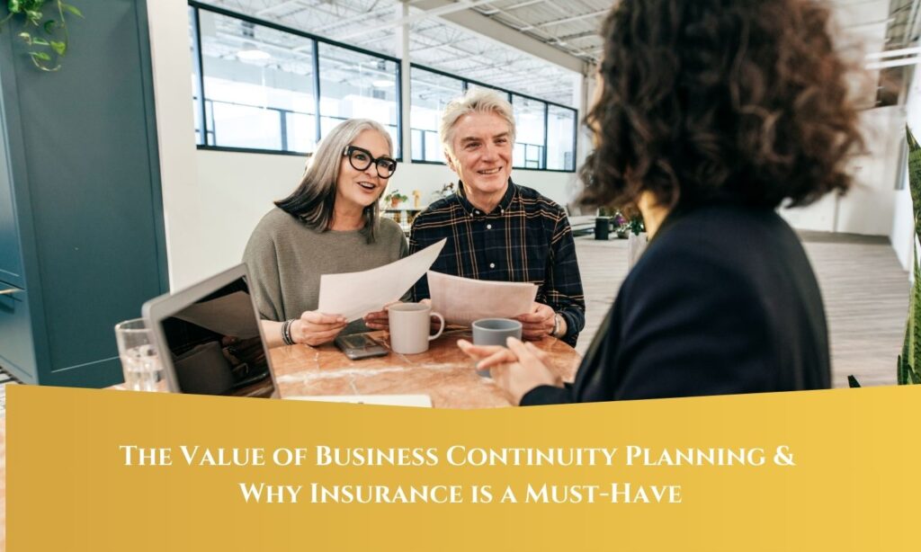 A middle-aged couple smiling and holding documents as they discuss plans with a professional across the table. The image includes a banner at the bottom that reads, "The Value of Business Continuity Planning & Why Insurance is a Must-Have."