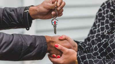 Solo real estate agent provides personalized, one-on-one service to a client in a bright and modern kitchen, representing ...